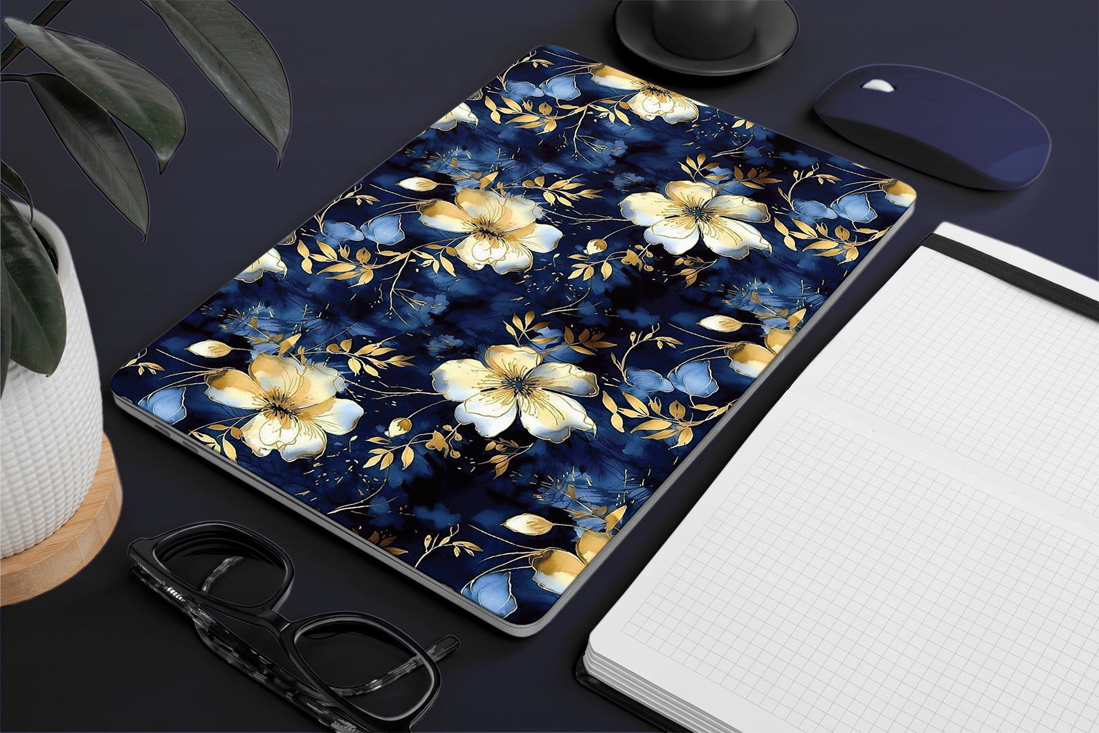 Floral macbook skin with blue and yellow flowers on a white background