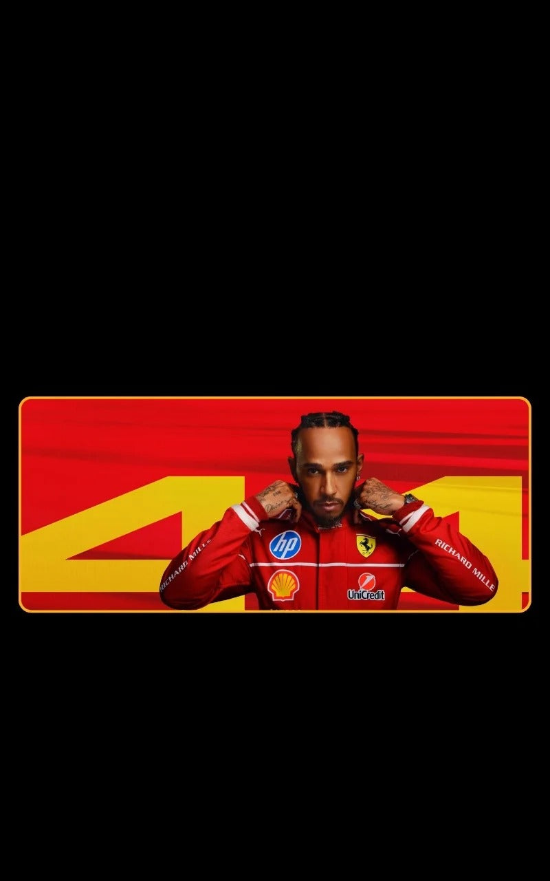lewis hamilton 44 wearing a red racing suit with visible branding on a black background