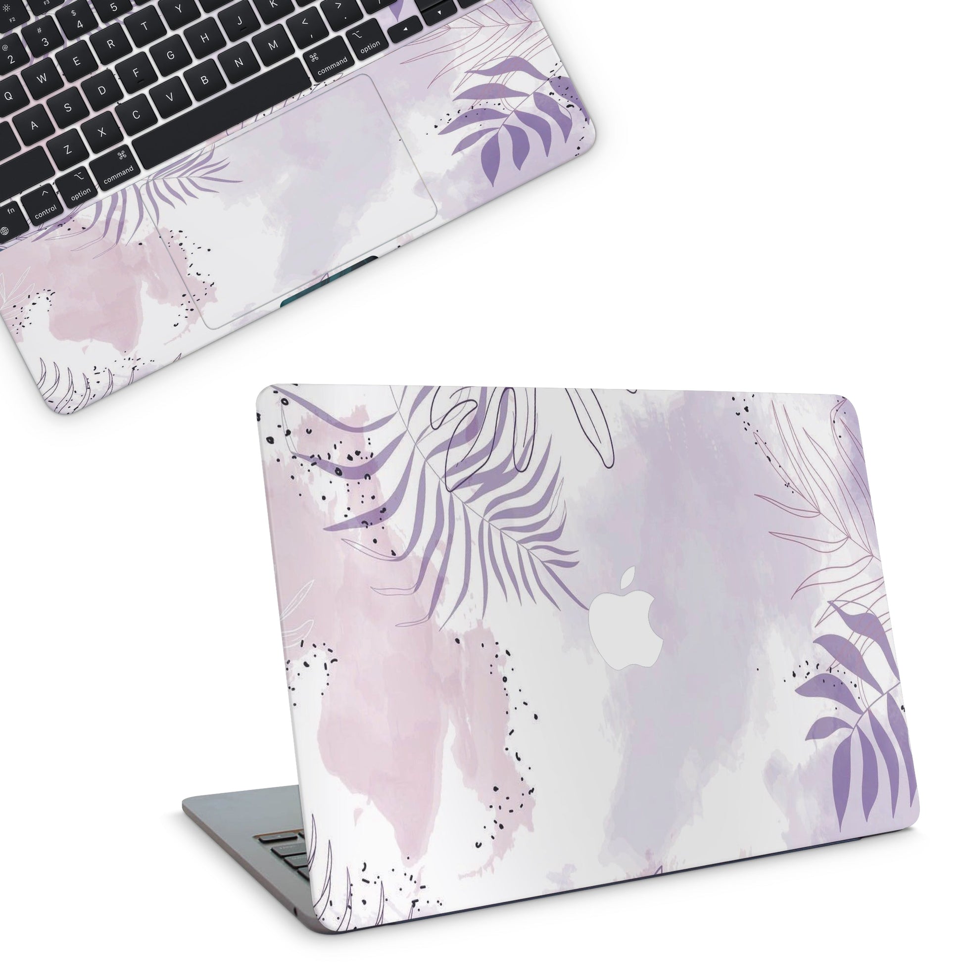 Laptop with a floral design skin on a white background