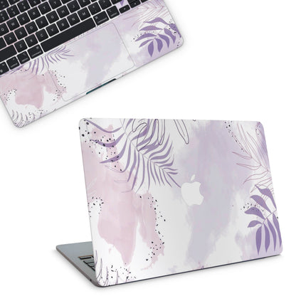 Laptop with a floral design skin on a white background