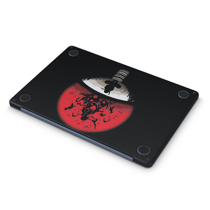 macbook skin with naruto uchiha clan logo on bottom