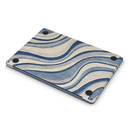 Blue and beige wavy patterned macbook skin on a white background