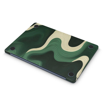 Macbook skin with green swirls on macbook bottom