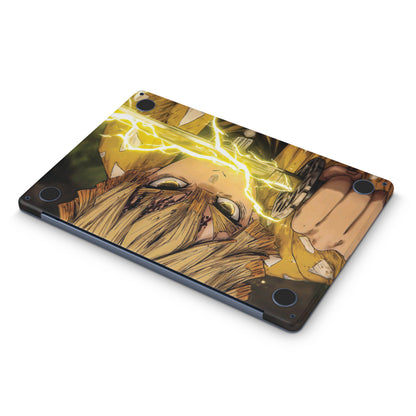 Macbook skin with demon slayer zenitsu design on bottom
