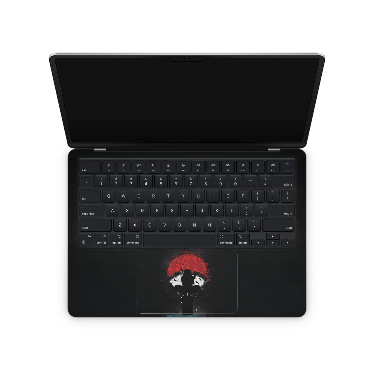 macbook skin with naruto uchiha clan logo on keyboard