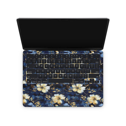 Floral macbook skin with blue and yellow flowers on a white background keyboard
