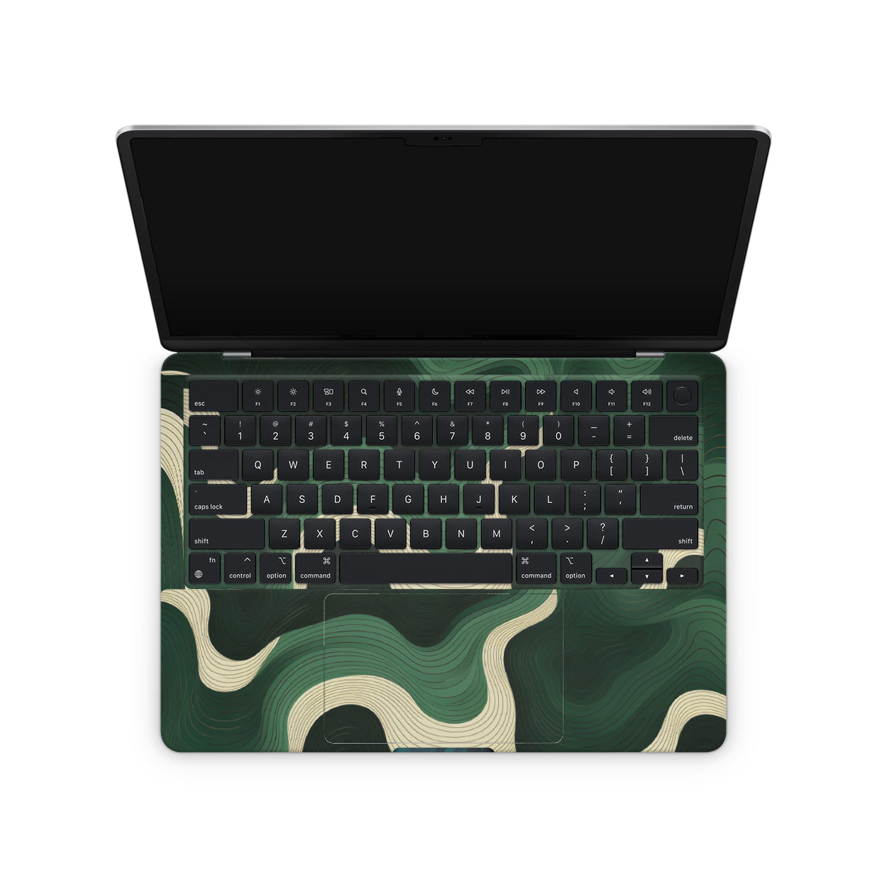 Macbook skin with green swirls on macbook keyboard