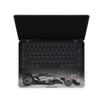Macbook skin with formula 1 car design on keyboard area