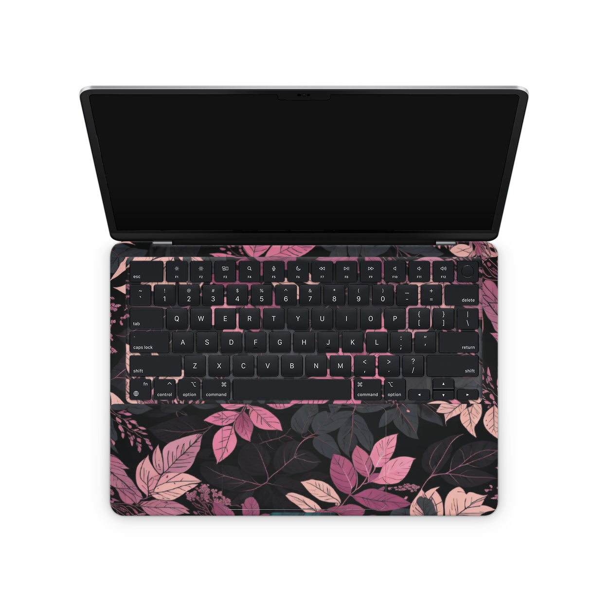 Laptop with a floral keyboard cover on a white background