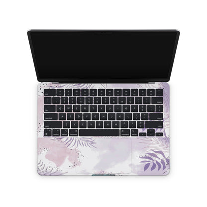 macbook with a floral keyboard cover 